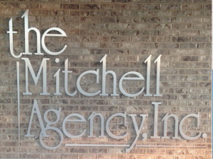 The Mitchell Agency logo on wall